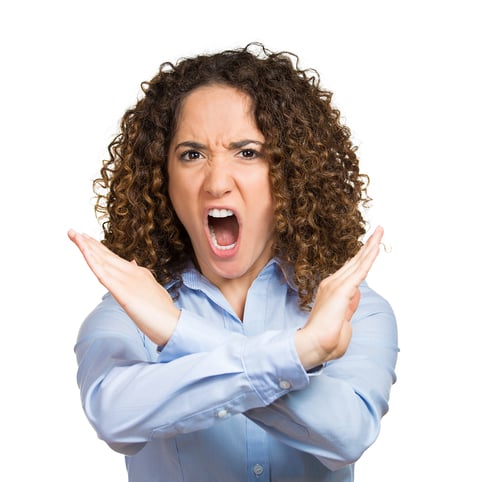 Closeup portrait angry, screaming young woman with X gesture to stop talking, cut it out, dont go there isolated white background. Negative emotion facial expression feeling sign symbol body language