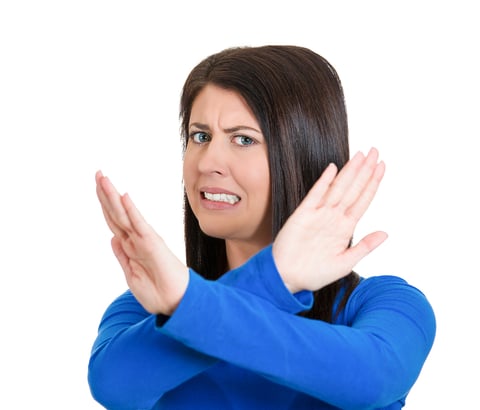 Closeup portrait of angry young woman with X gesture to stop talking, cut it out, dont go there, isolated on white background. Negative emotion facial expression feelings, signs symbols, body language-1