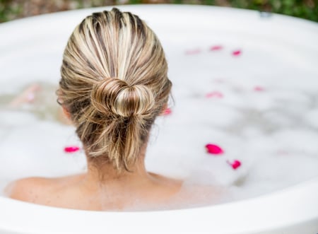 Woman taking a bubble bath - beauty concepts